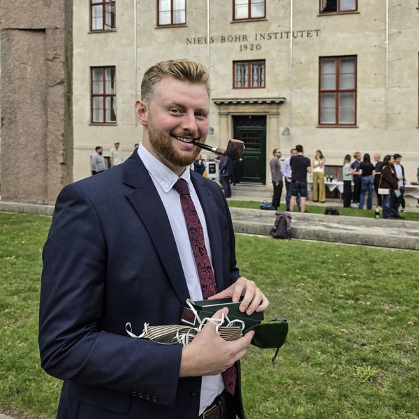 Conor Dyson posing for a photo after having successfully defended his PhD thesis.