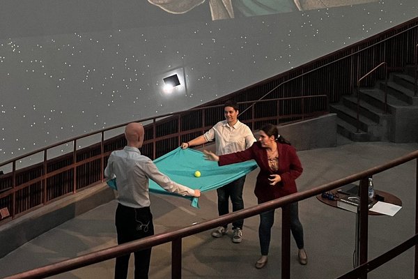 Leart Sabani, Lucía Vélez Tartajo and Ariadna Ribes Metidieri taking part in a public talk at the Tycho Brahe Planetarium in Copenhagen.